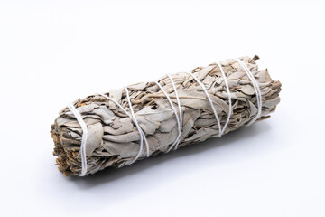 Bundle of dry white sage close-up isolated on white background. Normally used for purification, meditation and healing