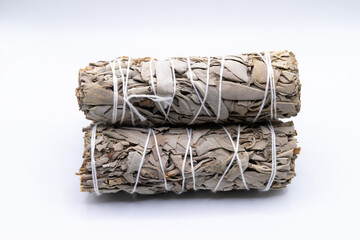 Bundles of dry white sage close-up isolated on white background. Normally used for purification,...