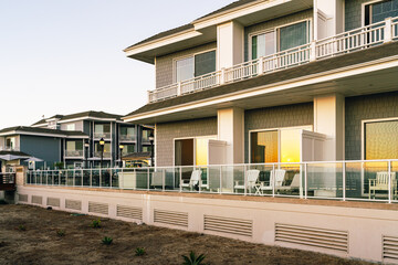 A beachfront hotel with balconies overlooking the ocean at sunset, Pismo Beach, California Central Coast