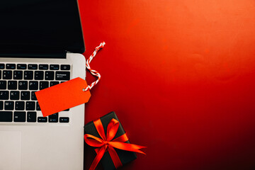 Cyber Black Friday sale concept Laptop, price tags, and festive ribbon. Shop online and save big...