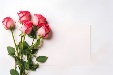 Fototapeta premium Paper card center of image, pink rose and red rose bunch on the left, all of them on white background, clean lighting, top view, valentine's day concept.