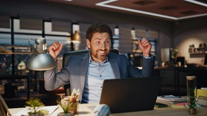 Business man feeling success working laptop dark office closeup. Happy director