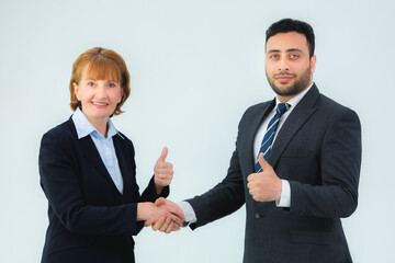 business man and business woman shaking hands in the office