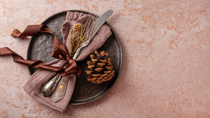 web banner New Year and Christmas eco table setting concept. Black empty plate and silver cutlery with eco Christmas ornaments on the beige background top view