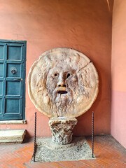 Mouth of Truth is a marble mask in Rome, Italy, which stands against the left wall of the portico...