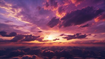 Fototapeta premium the sun is setting over the clouds in the sky 