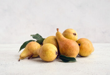 Heap of ripe pears on white background