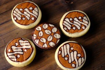 Bakpia Kukus Batik, is a modern bakpia containing melted cheese or chocolate cooked by steaming. The top of the bakpia is painted with traditional batik motifs. Indonesian food.