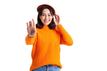 Young woman in beret and warm sweater on white background