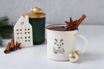Celebrating, celebrating Christmas, New Year, preparing mulled wine. Cups with red wine and spices, New Year decorations, decor. Light composition, horizontal.