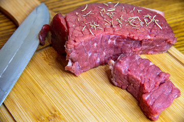 fresh raw meat with rosemary