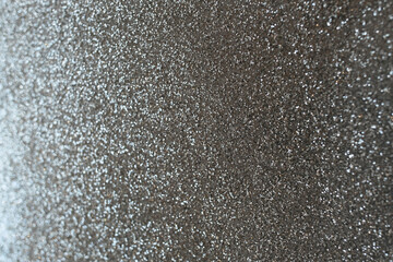 Silver glitter texture background sparkling shiny wrapping paper for Christmas holiday seasonal wallpaper decoration, greeting and wedding invitation card design element. Selective focus