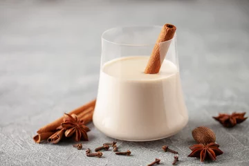 Foto auf Acrylglas Traditional Christmas milk cocktail - Eggnog with cinnamon © murziknata