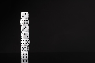 White dice on black background studio shot