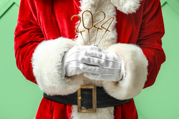 Santa Claus with figure 2024 on green background