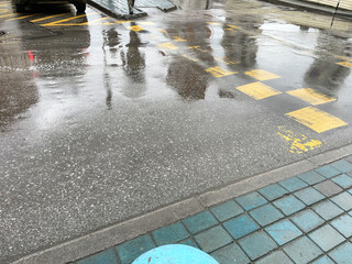 Rainy day in the city. Rainy weather on the street.