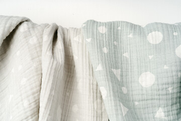 Muslin baby blanket on white background studio shot
