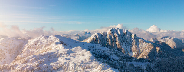 Snow covered Mountain Peak. Canadian Nature Aerial Background Panorama.