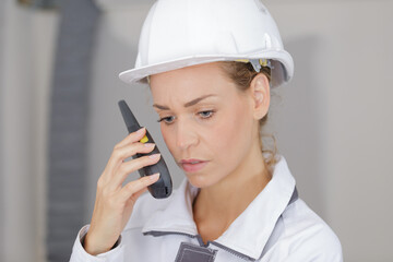 woman engineer on building site checking construction
