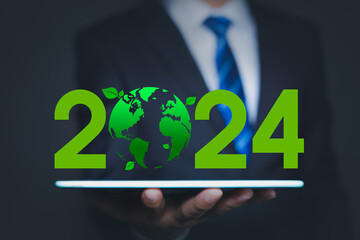 Corporate Social Responsibility (CSR), Eco-Friendly business and environmental 2024 concept. Businessman with green globe