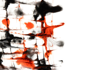 black and red splashes of paint on a white background.