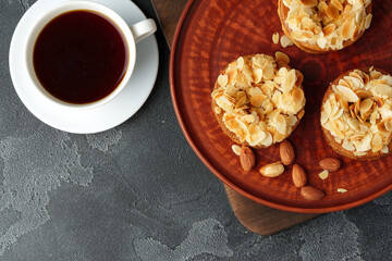 Tart pie with almond petals on plate