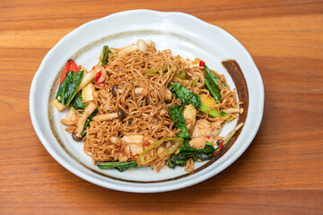 Spicy Stir Fried Instant Noodle with Seafood and basil Thai food style.
