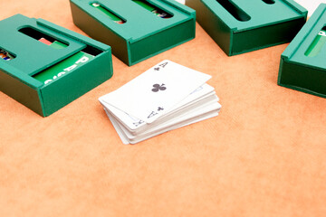 Playing cards and boxes for playing bridge. Gambling, bridge, poker concept. Sport equipment.