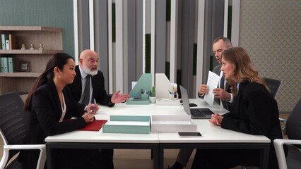 Tense business partners sitting in company office building and dispute about work, signing contract agreement paper. Company corporate meeting. Tensely business people office workers lawyers investors - Powered by Adobe