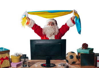 Joyful santa claus, soccer fan, watches a game on television