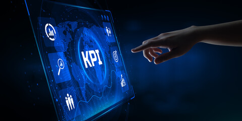KPI Key Performance Indicator. Hand pressing button on screen.