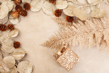 Golden Festive background with leaves and pine cones