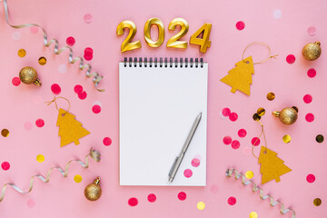 Notebook with pen and space for text for writing future plans. 2024 is coming. New Year goals,...