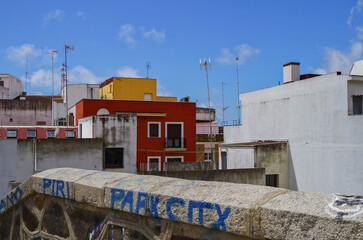 Street city view with cars and traffic, house facades cityscape skyline of Huelva, Spain Cristopher Columbus birth place