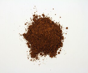 Cocoa powder isolated on white background. Close-up.