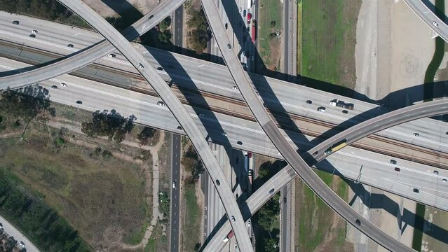 Drone view of complex highway interchange of 710 freeway parallel to Los Angeles river