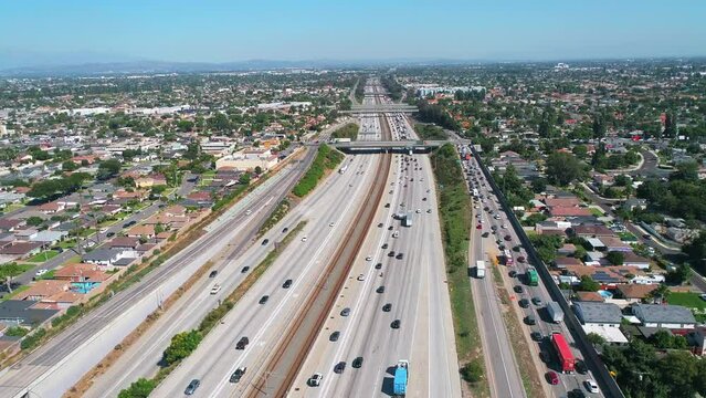 Aerial drone following traffic driving down 710 Interstate in Los Angeles, California