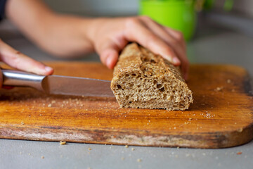 cut buckwheat bread on a cutting board in the kitchen