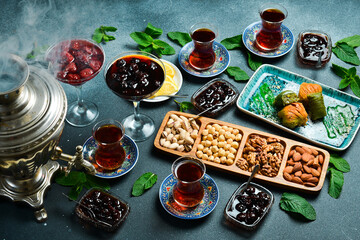 Tea ceremony. Azerbaijani traditional serving of tea. Tea, dried fruits and nuts. Top view.