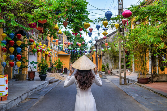 Asian woman wearing vietnam culture traditional at Hoi An ancient town, Vietnam. Hoi An is one of the most popular destinations in Vietnam  from Korea, Thailand, USA, Japan, China
