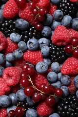 Assortment of fresh ripe berries as background, top view