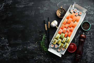 Japanese food. Set of sushi rolls with caviar, fish and shrimp. Food delivery. Free space for text.