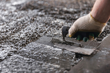 Construction site of buildings pouring cement. Top view new screed concrete with leveling mortar...