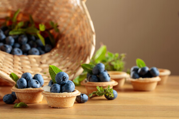 Small tartlets with fresh blueberries and mint.