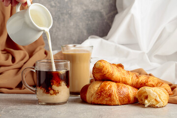 Croissants and coffee with cream.
