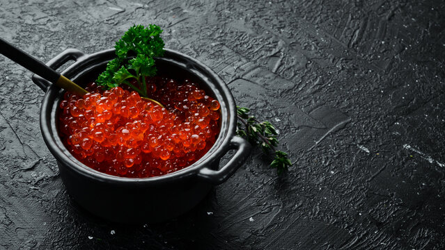 Red caviar of high quality. Caviar in a caviar bowl Macro photo of caviar. Top view.