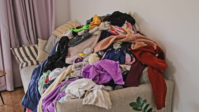 Heap of Dry Laundry Clothes before Ironing and Folding