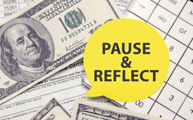 PAUSE AND REFLECT on yellow sticker with dollars and calculator