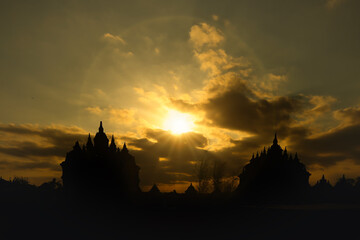 Golden evening sky creating silhouette of the great Plaosan Hindu temple in Klaten, Yogyakarta