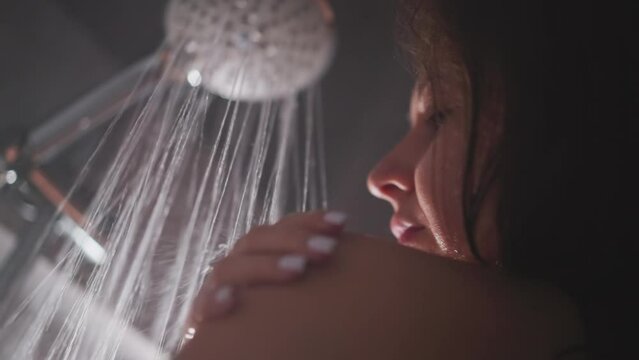 Woman takes pleasure in cozy warmth of shower